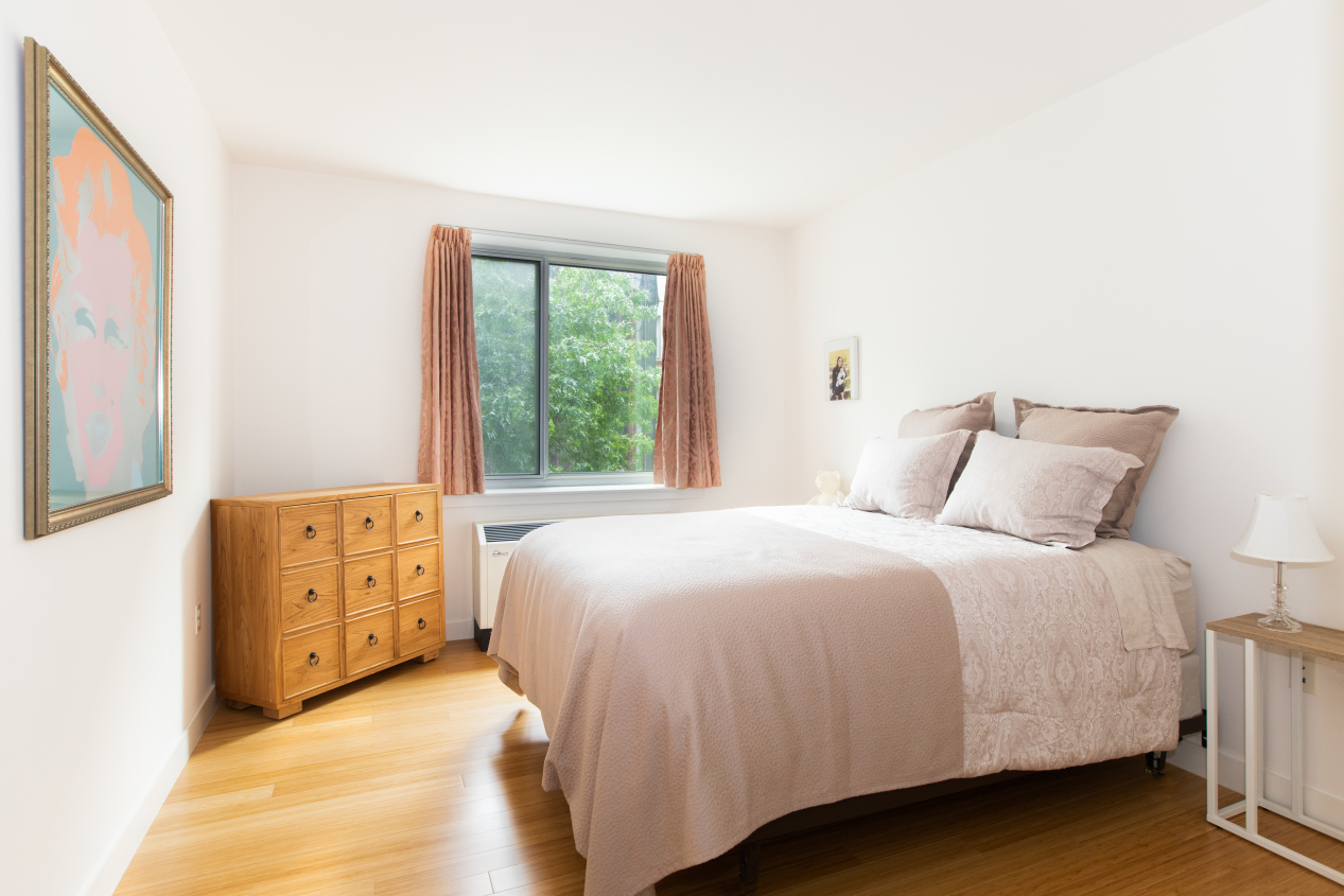 40 West 116th Street, Unit A406 Manhattan, NY 10026 - Photo 8 of 14 a bedroom with a bed and a dresser