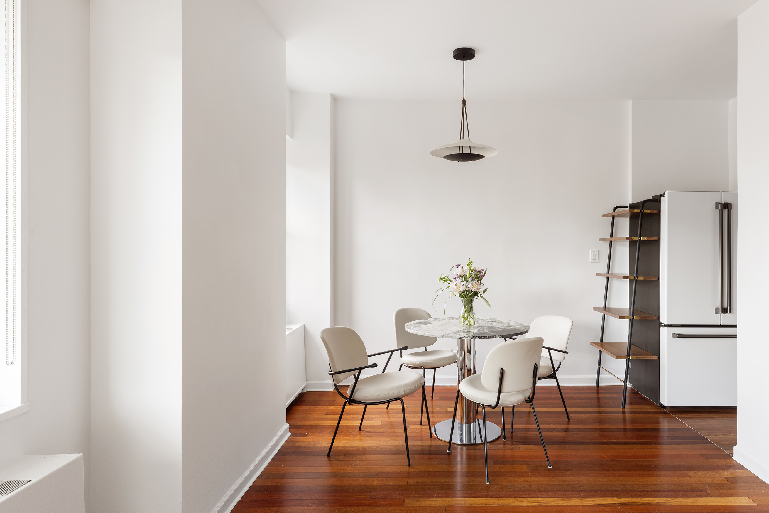 60 East 8th Street, Unit 10E Manhattan, NY 10003 - Photo 3 of 13 a view of a dining room with furniture