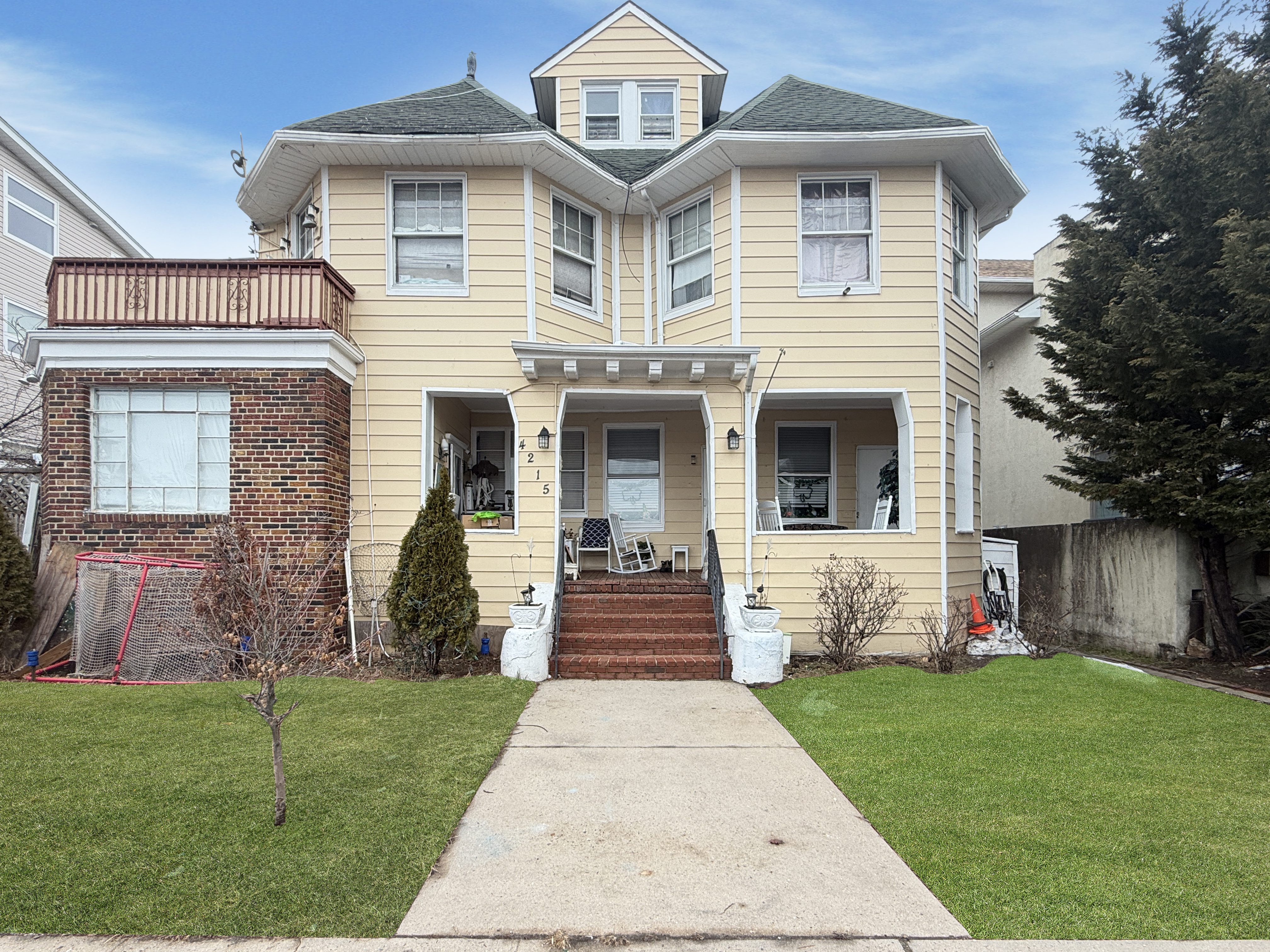 4215 Atlantic Avenue Brooklyn, NY 11224 - Photo 2 of 21 a front view of a house with garden