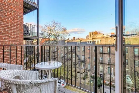 a view of a balcony with chair