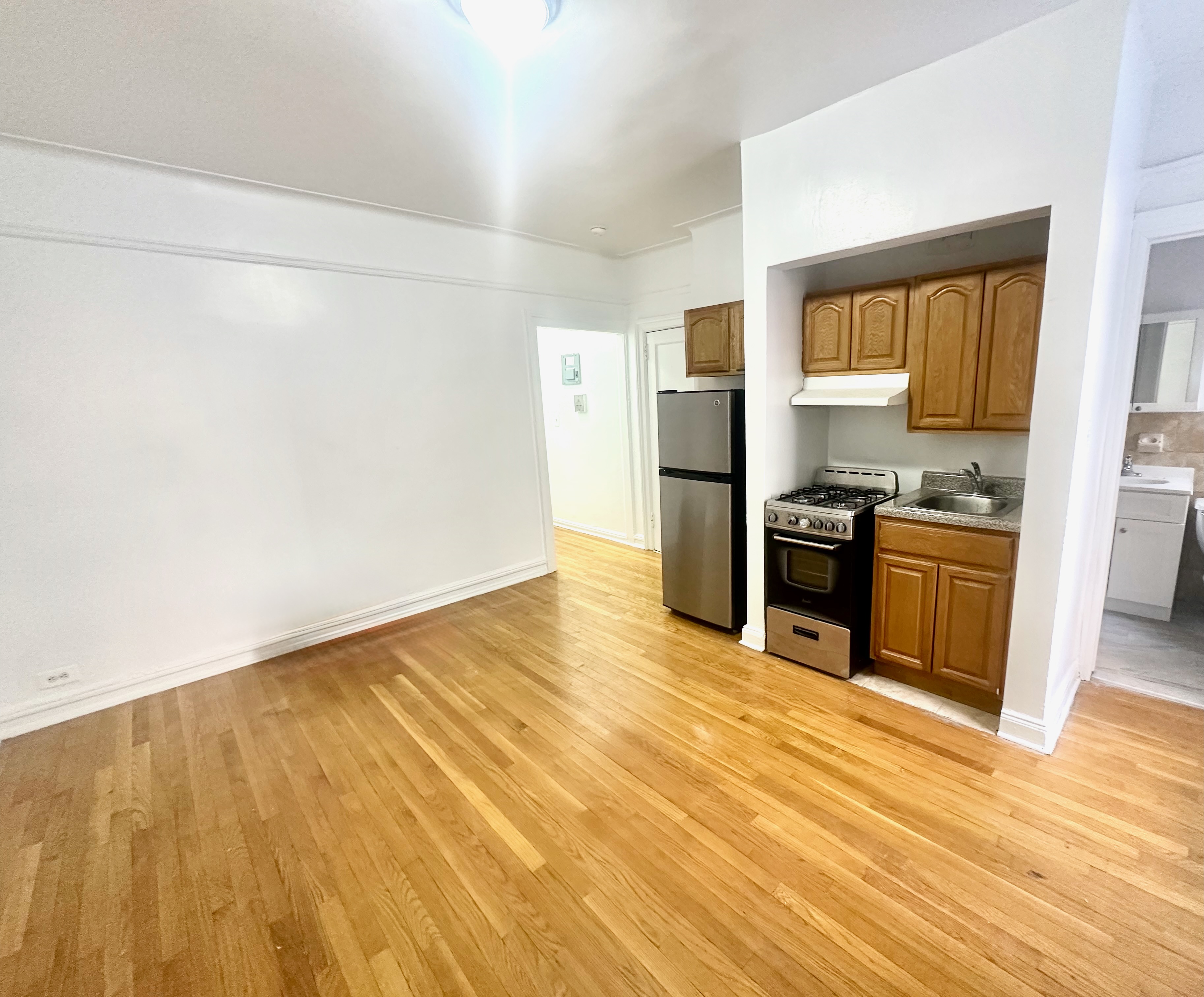 517 West 161st Street, Unit 4 Manhattan, NY 10032 - Photo 1 of 3 a view of kitchen with wooden floor