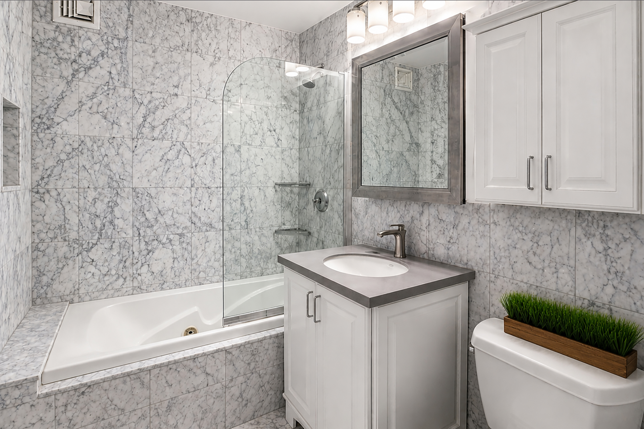 112-01 Queens Boulevard, Unit 21B Queens, NY 11375 - Photo 9 of 25 a bathroom with a sink a toilet and shower