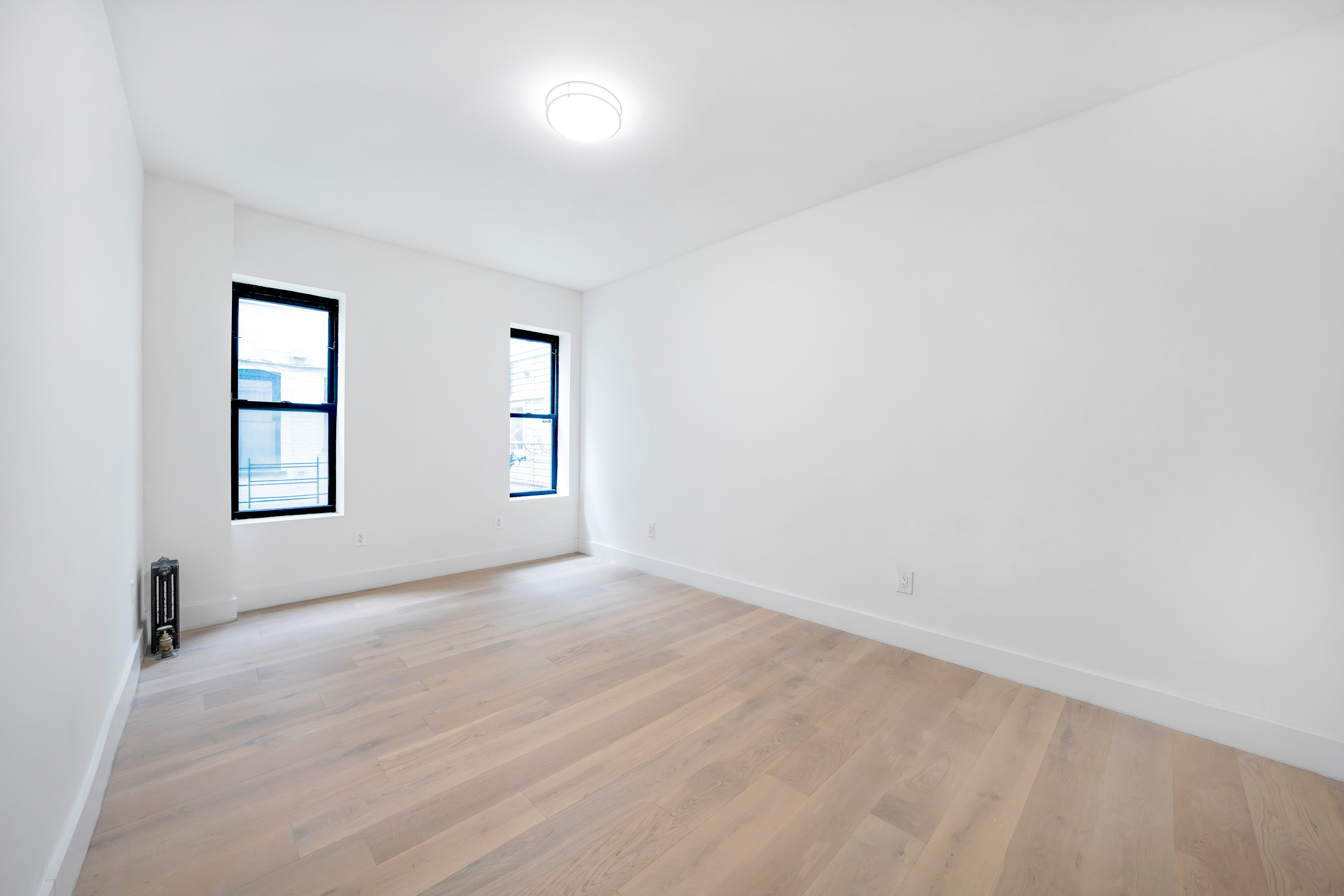 640 Ditmas Avenue, Unit 23 Brooklyn, NY 11218 - Photo 5 of 9 an empty room with windows