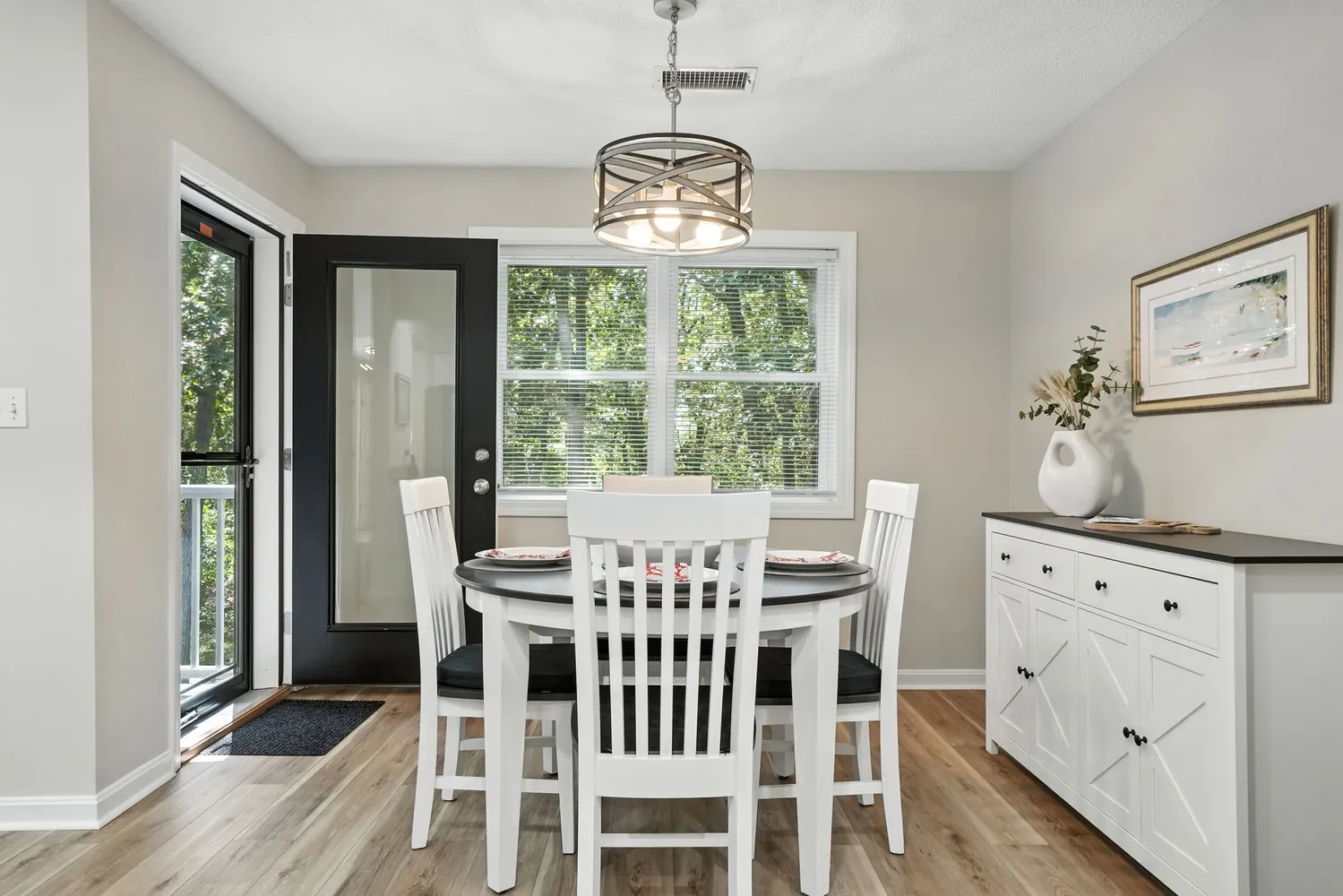 a view of a dining room with furniture window and outside view