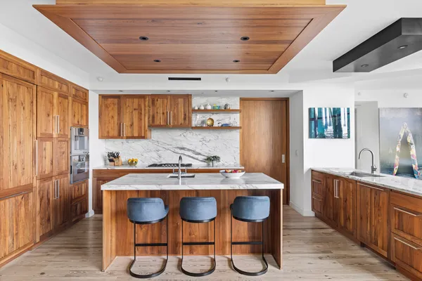 a kitchen with a dining table and chairs