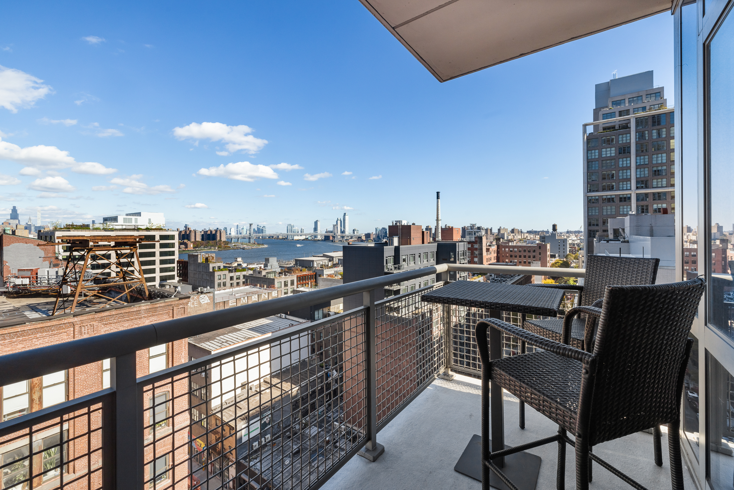 100 Jay Street, Unit 15C Brooklyn, NY 11201 - Photo 4 of 19 a view of a chairs and table in a balcony