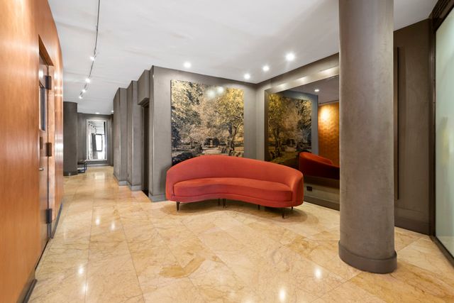 32 Gramercy Park South, Unit 12D Manhattan, NY 10003 - Photo 10 of 14 a bed room with a bed and a large window