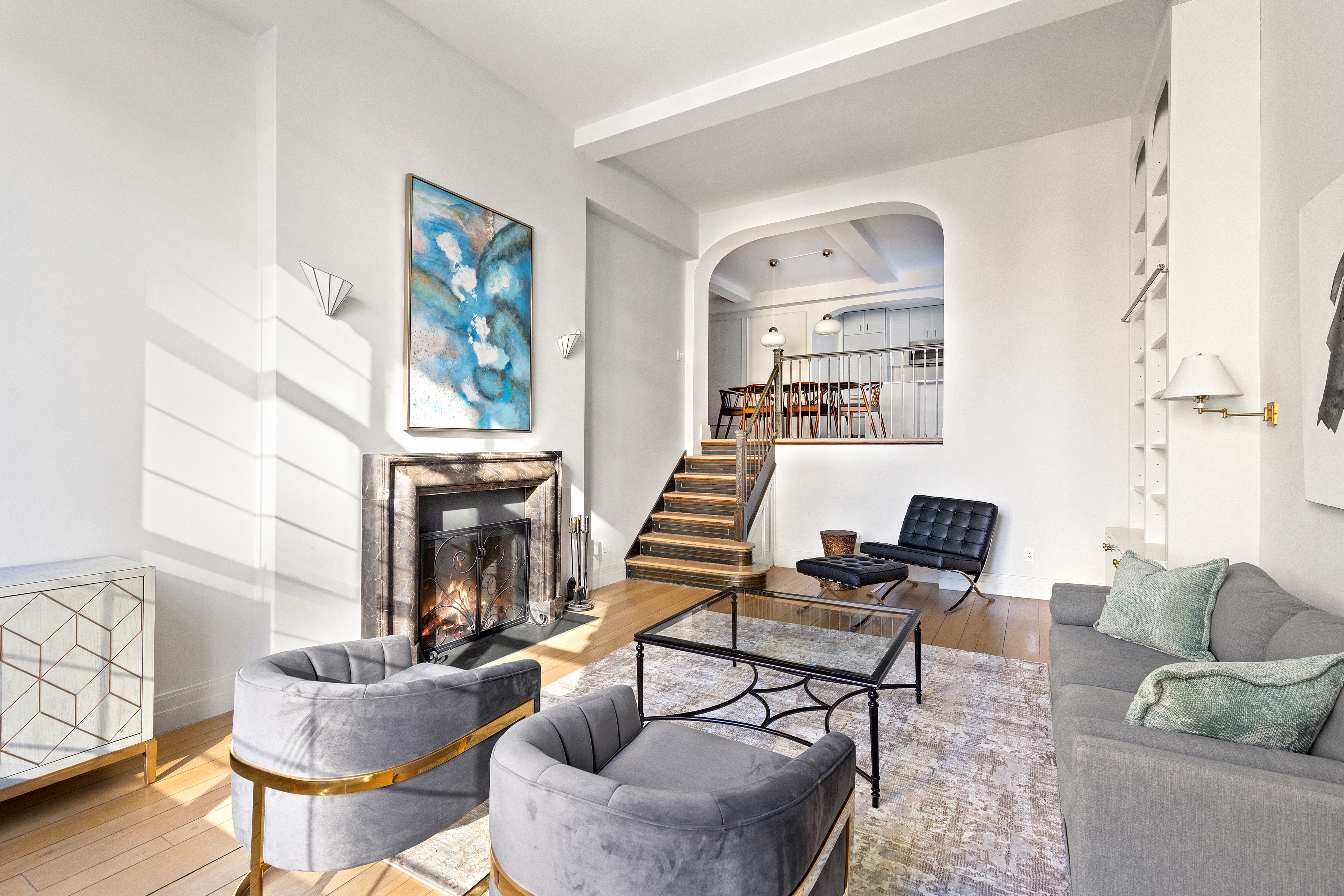 434 East 52nd Street, Unit 10E Manhattan, NY 10022 - Photo 2 of 13 a living room with furniture and a fireplace