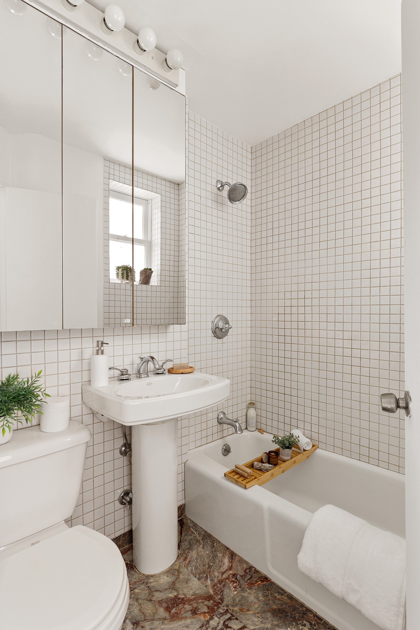 333 West 21st Street, Unit 2FE Manhattan, NY 10011 - Photo 6 of 10 a bathroom with a sink toilet and shower