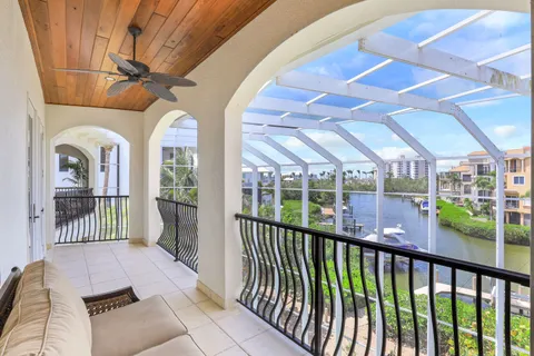 a kitchen with white cabinets and sink