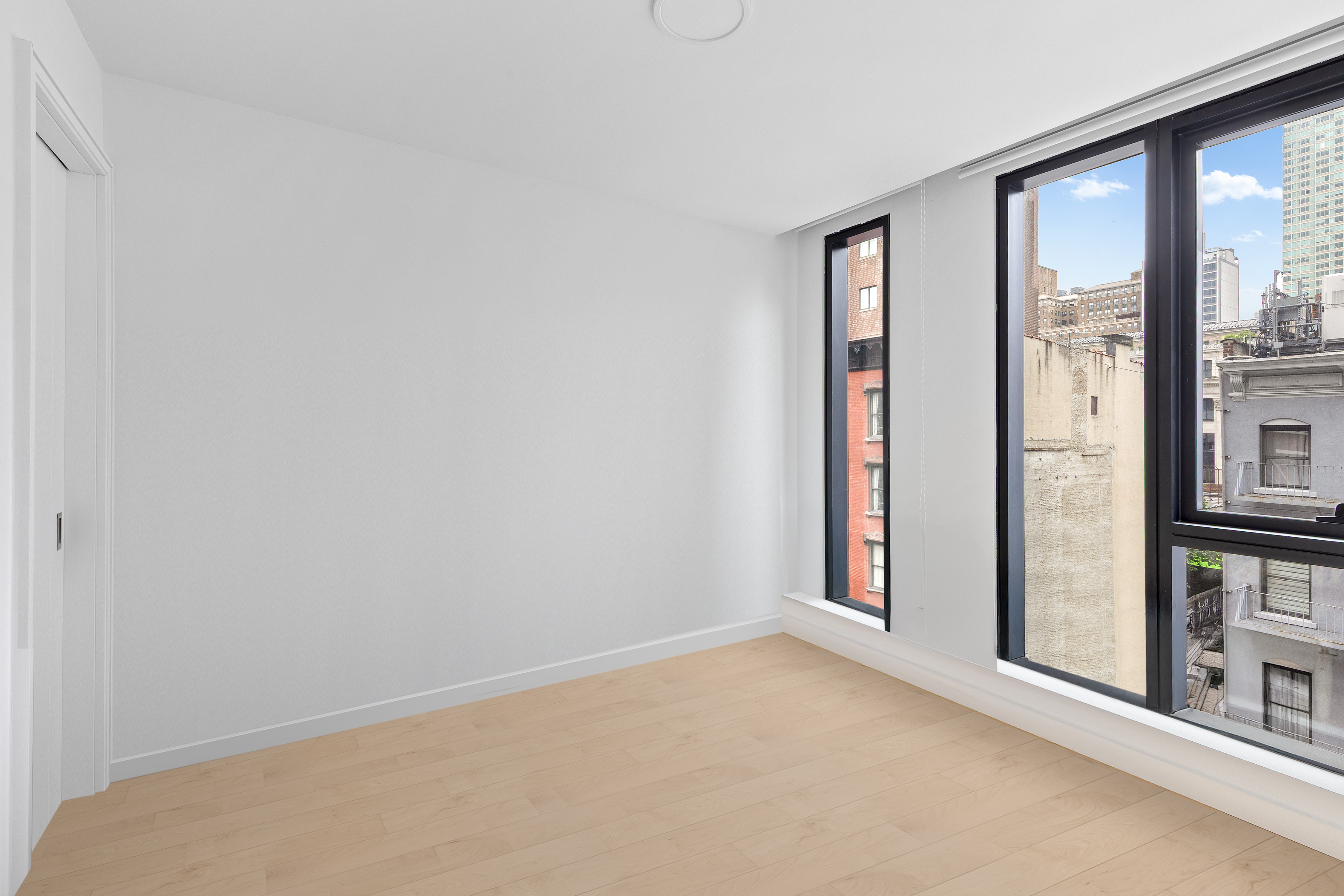 300 West 30th Street, Unit 4A Manhattan, NY 10001 - Photo 6 of 15 a view of a room with a large window