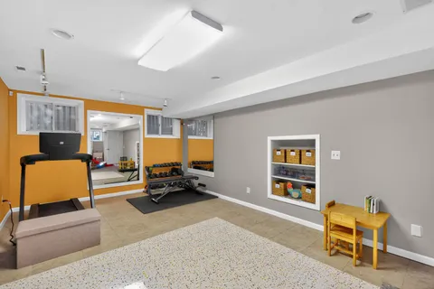 a view of entryway and workspace with wooden floor