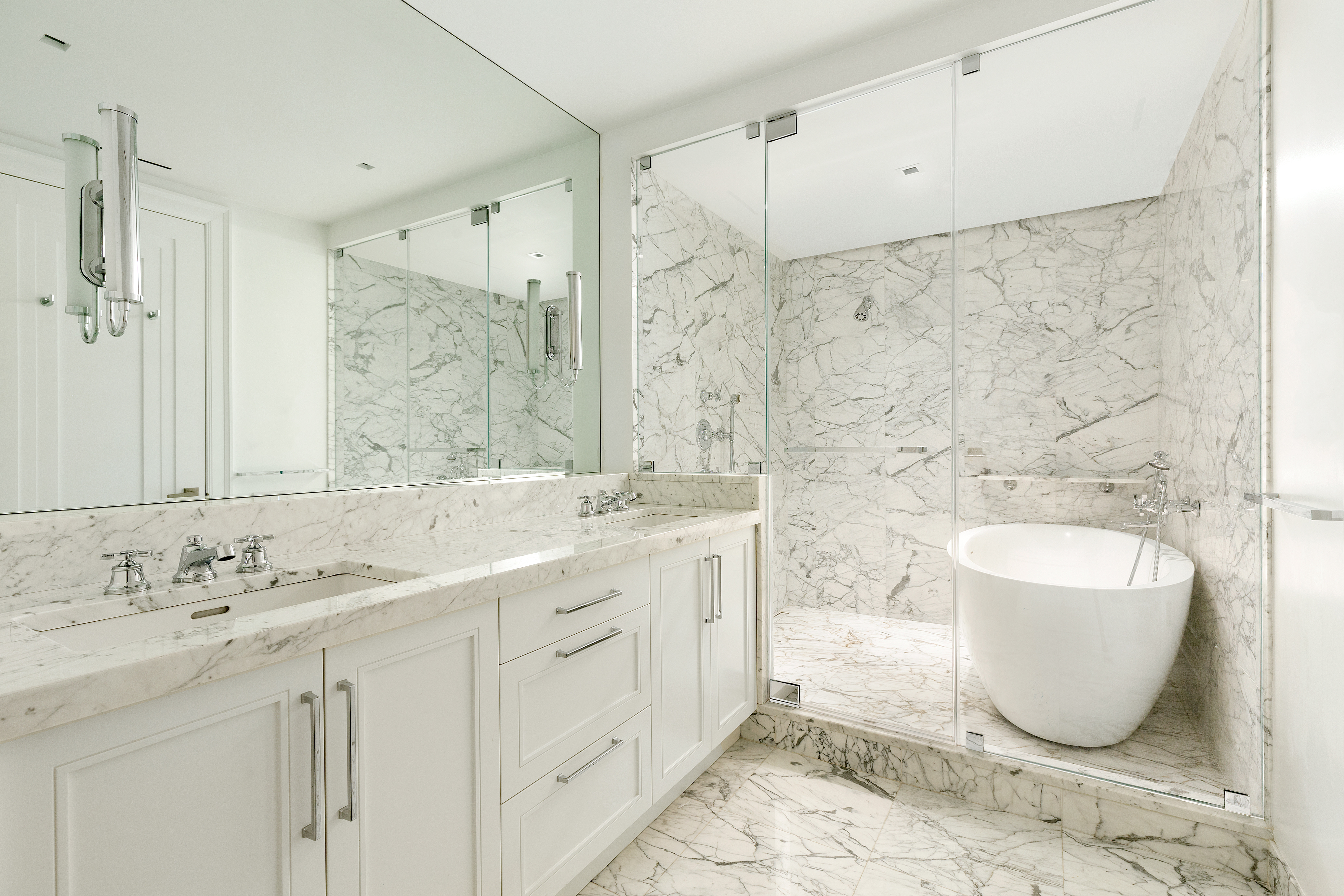 55 Liberty Street, Unit 15 Manhattan, NY 10005 - Photo 17 of 25 a spacious bathroom with a double vanity sink mirror and bathtub