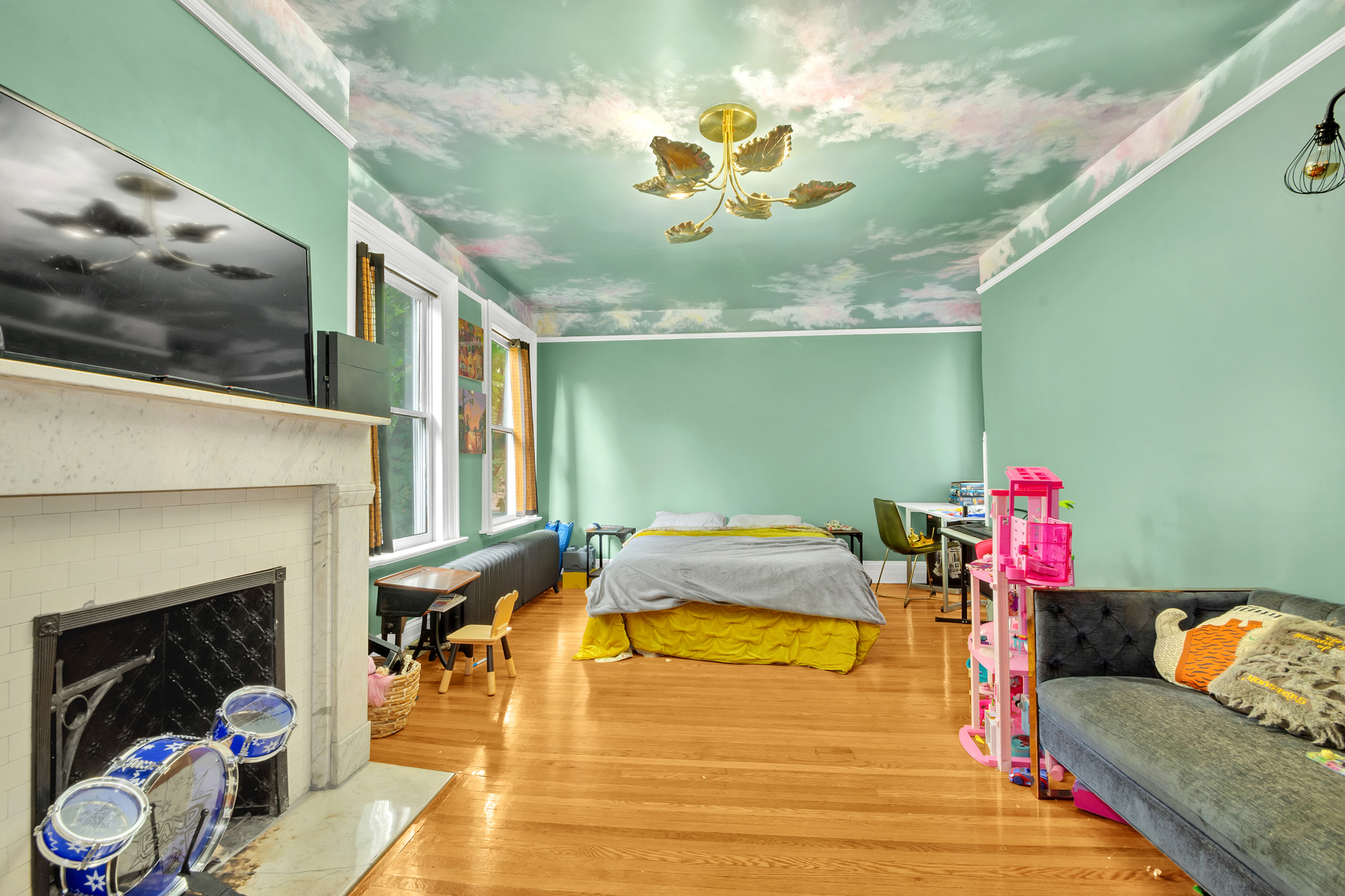 117 Tysen Street Staten Island, NY 10301 - Photo 10 of 19 a living room with furniture and a fireplace