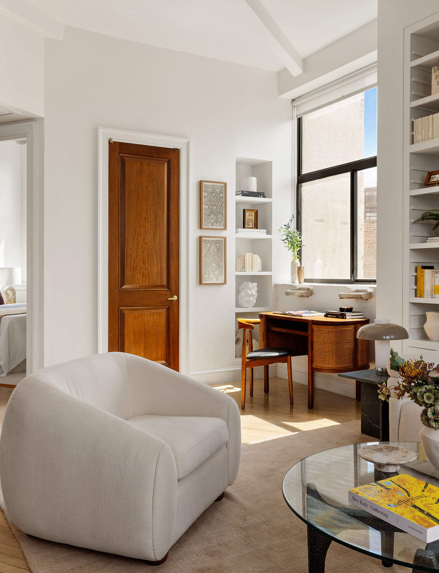 2 Cornelia Street, Unit 506 Manhattan, NY 10014 - Photo 8 of 11 a living room with furniture and large windows