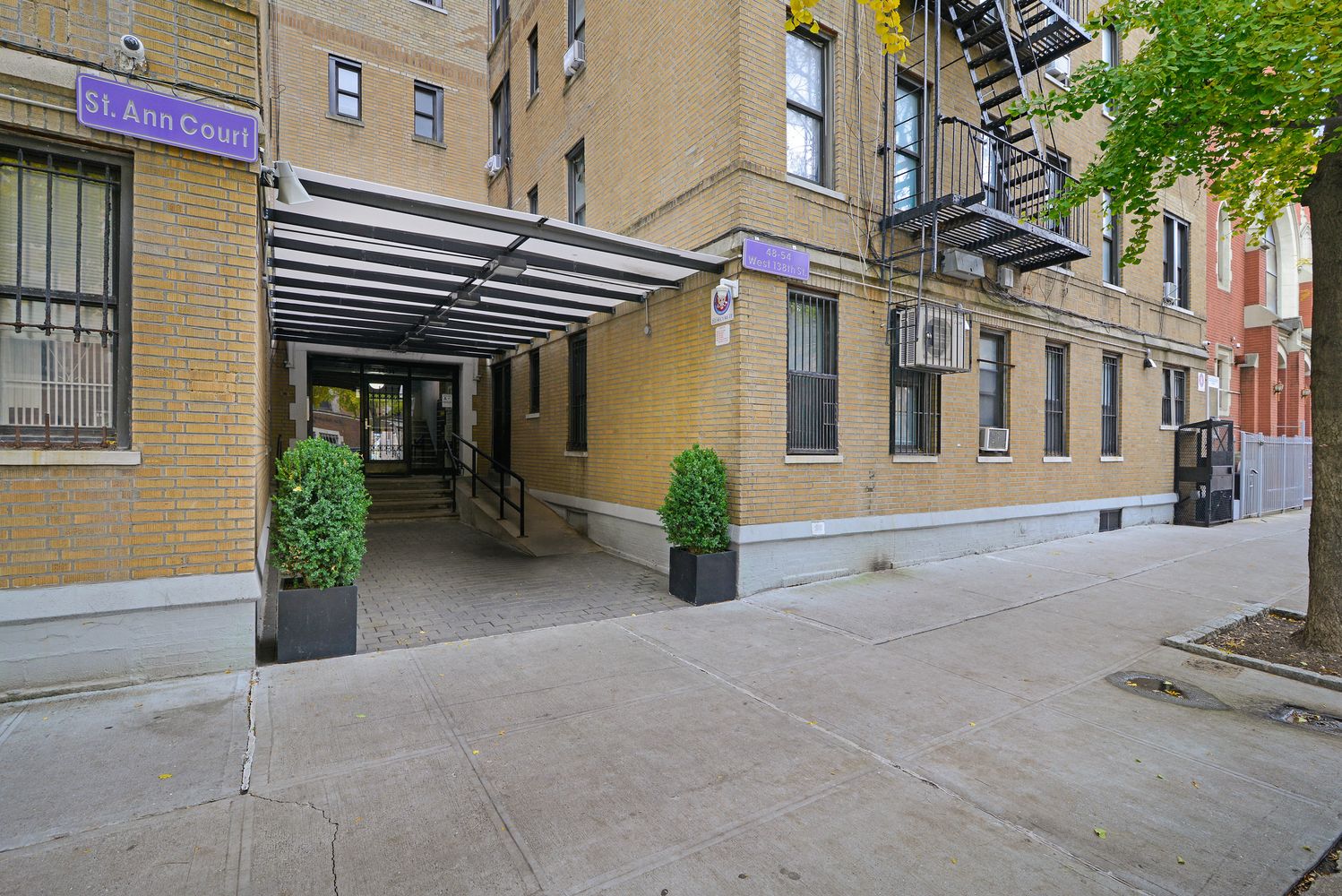 48 West 138th Street, Unit 6A Manhattan, NY 10037 - Photo 8 of 9 a view of a house with a patio