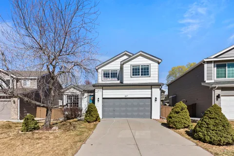 a front view of a house with yard