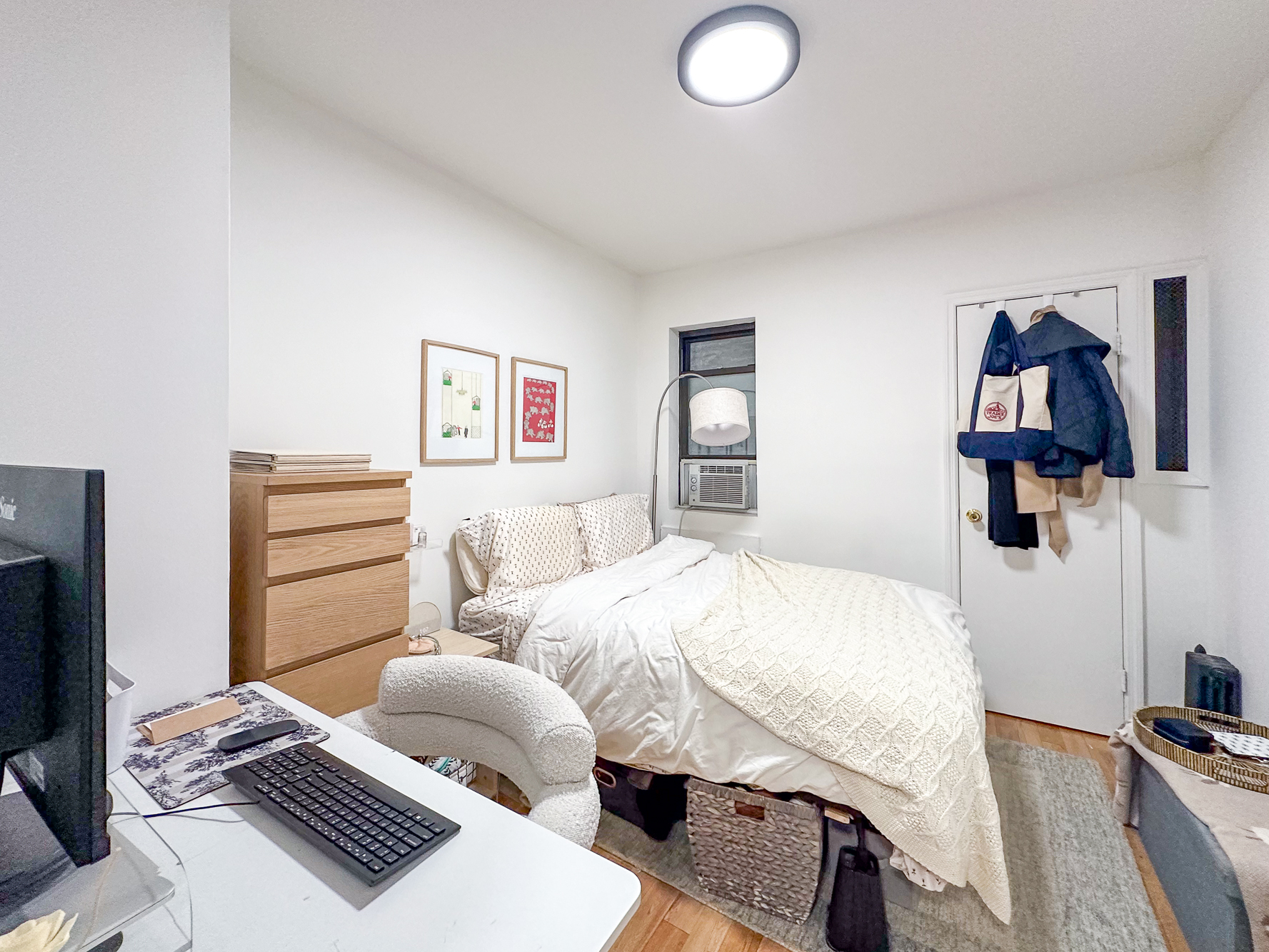 321 East 25th Street, Unit 3A Manhattan, NY 10010 - Photo 6 of 15 a bedroom with a bed and wooden floor