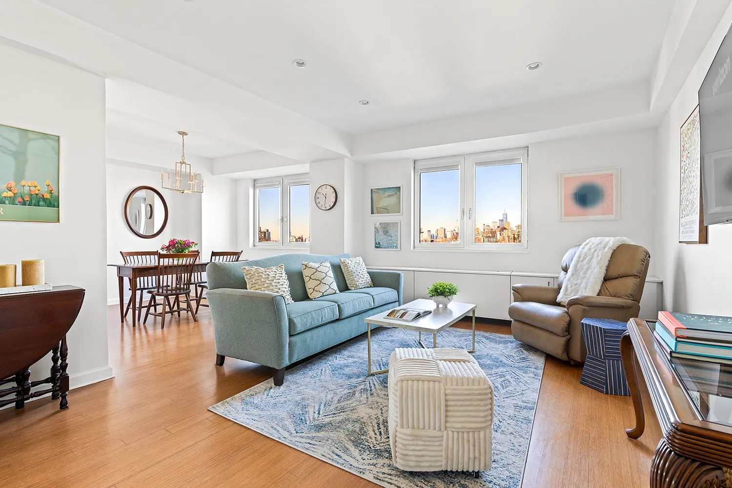 a living room with furniture and wooden floor