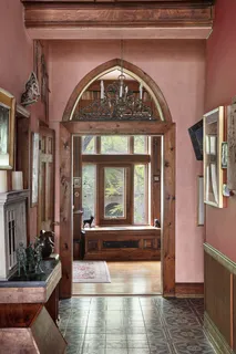 a living room with furniture and a book shelf