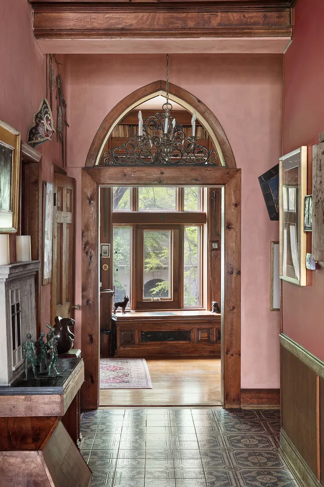a living room with furniture and a book shelf
