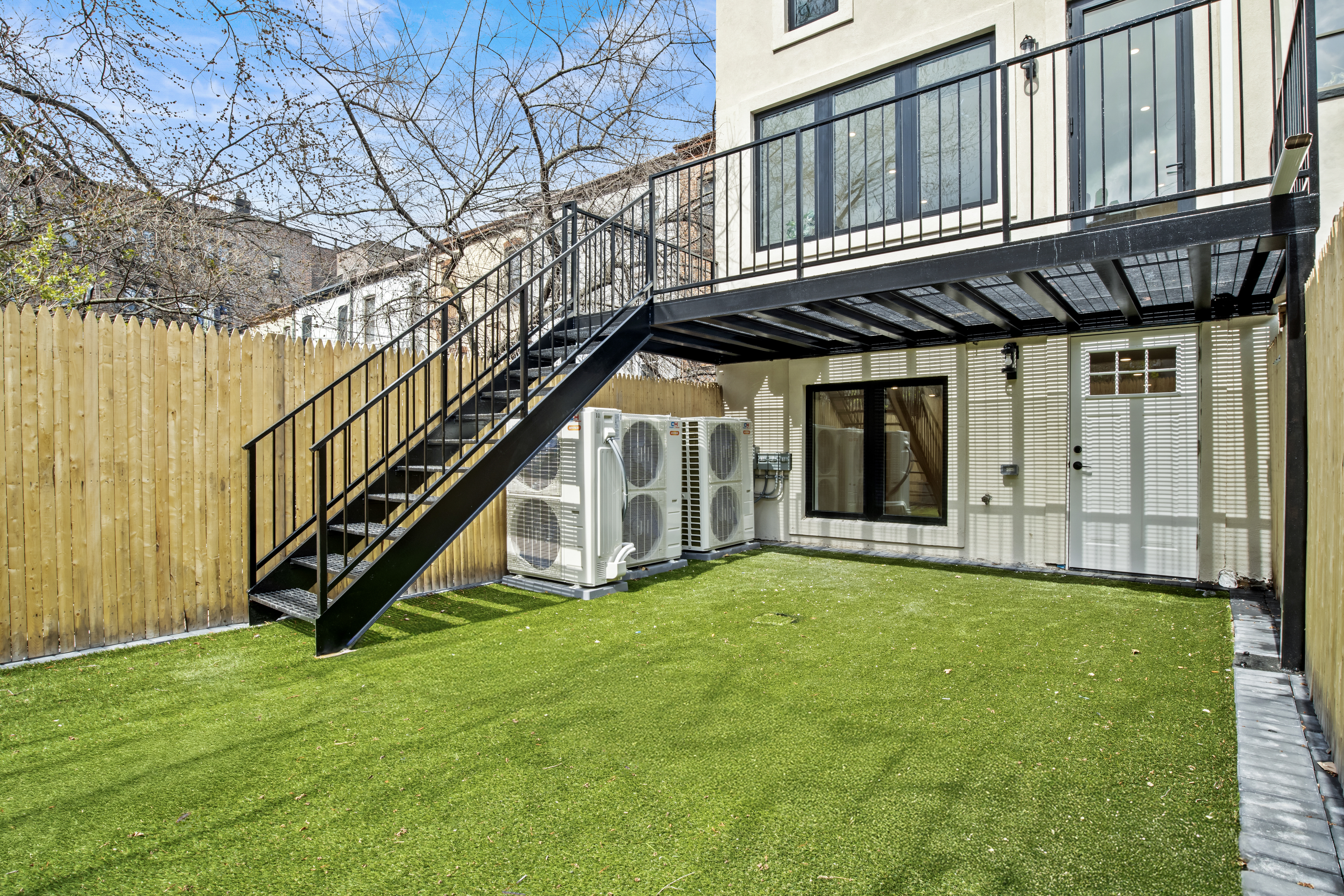 320 10th Street Brooklyn, NY 11215 - Photo 34 of 41 a view of an house with backyard and deck