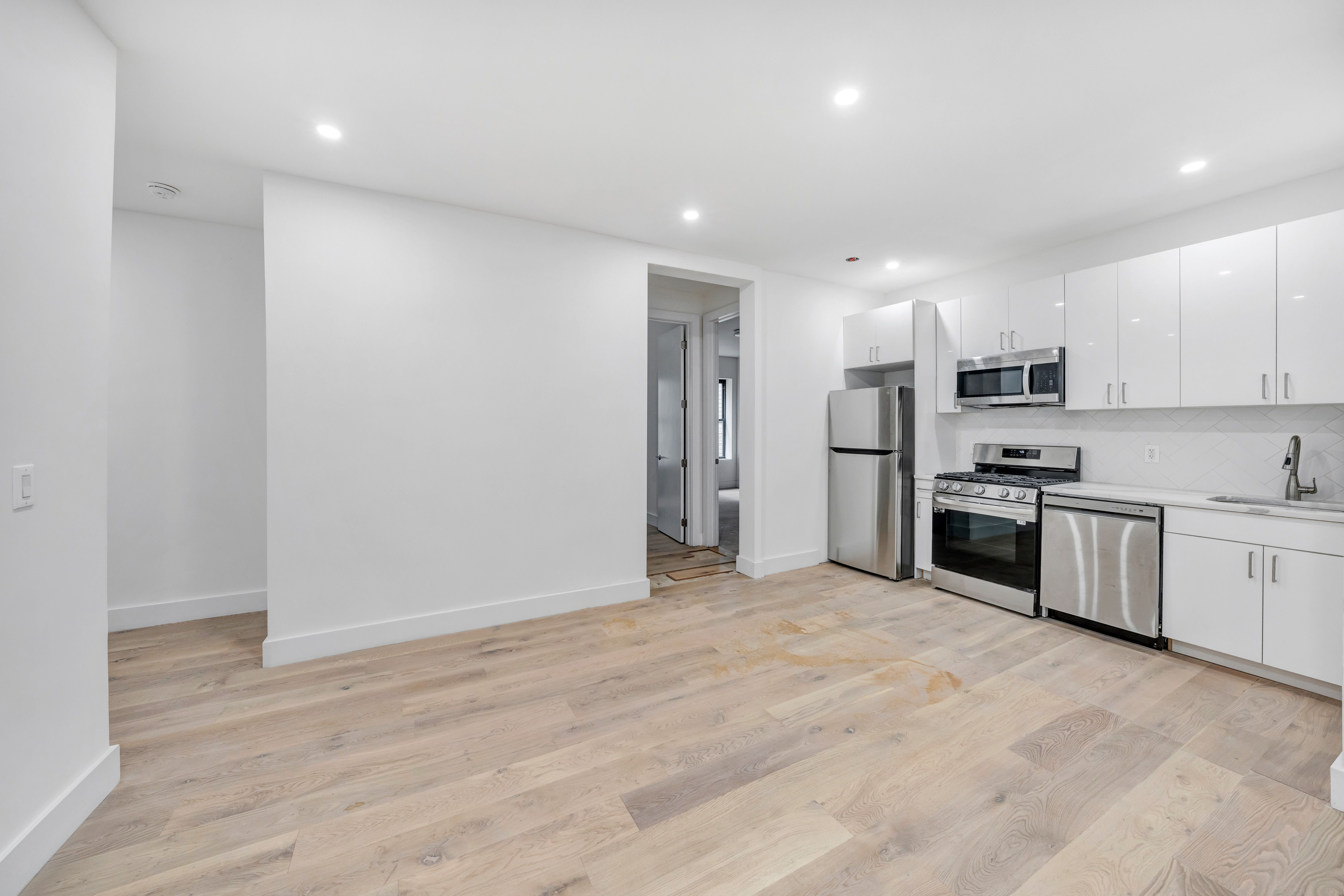 640 Ditmas Avenue, Unit 23 Brooklyn, NY 11218 - Photo 2 of 9 a kitchen with stainless steel appliances a refrigerator and a stove top oven
