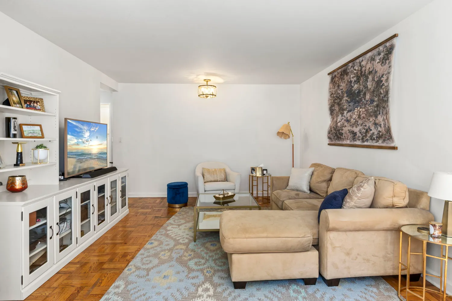 a living room with furniture and a flat screen tv
