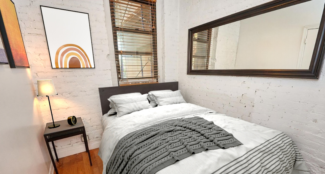 170 Elizabeth Street, Unit 1 Manhattan, NY 10012 - Photo 10 of 16 a bedroom with a bed and a window