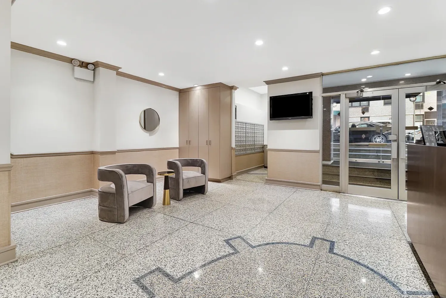 a living room with furniture a flat screen tv and outdoor view