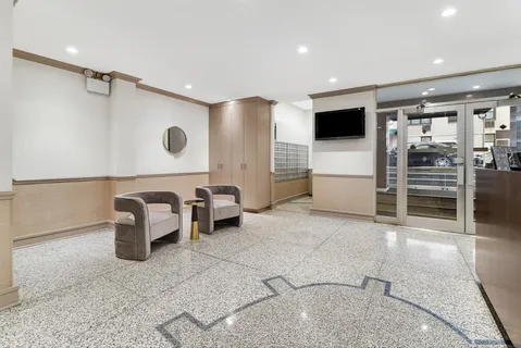 a living room with furniture a flat screen tv and outdoor view