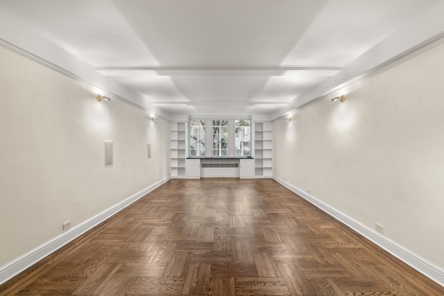 110 East 87th Street, Unit 2C Manhattan, NY 10128 - Photo 6 of 13 a view of empty room with wooden floor