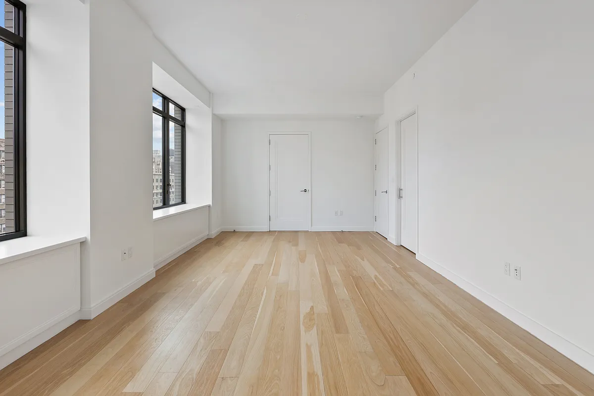 269 West 87th Street, Unit 14A Manhattan, NY 10024 - Photo 6 of 23 a view of a room with wooden floor and windows