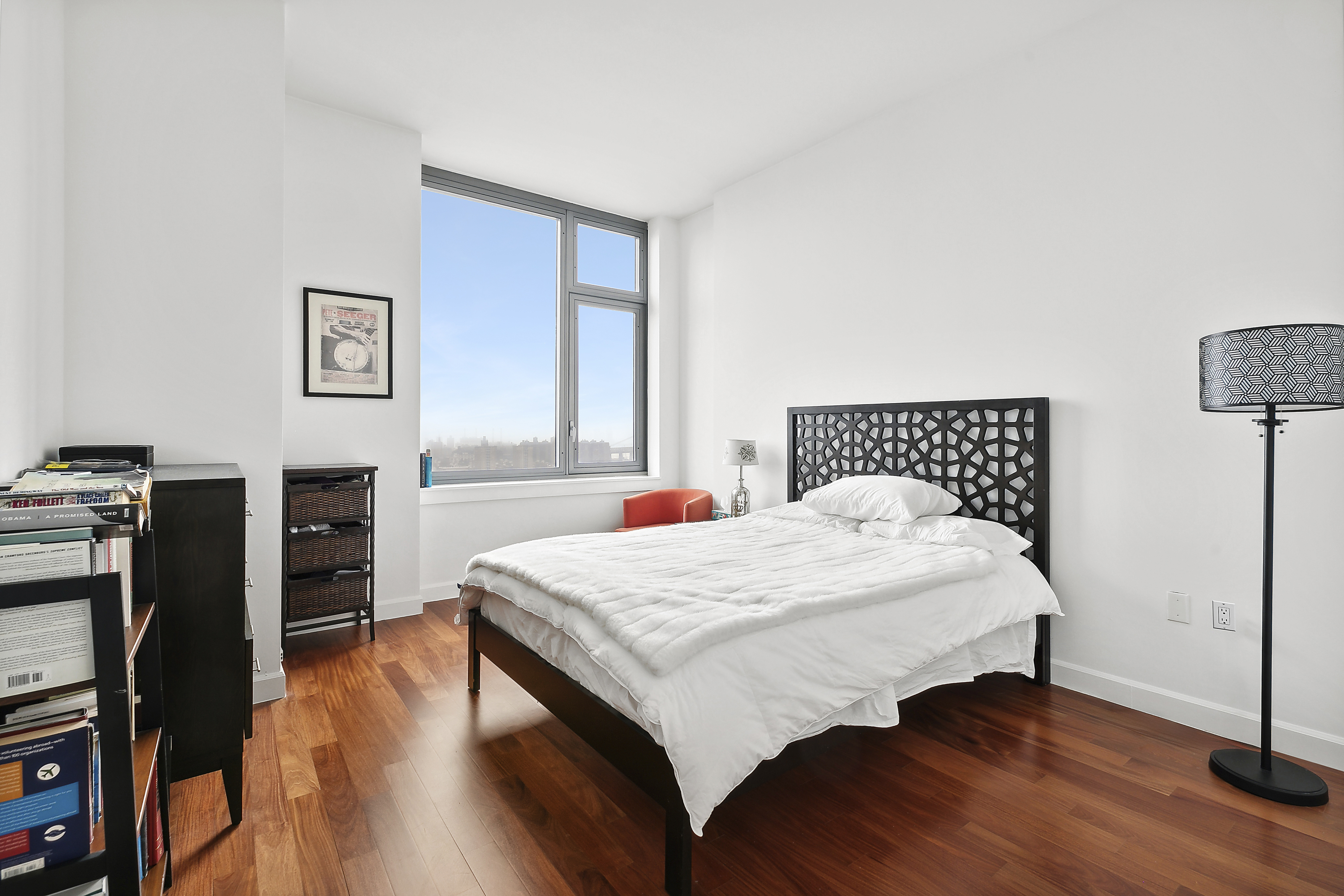 100 Jay Street, Unit 26B Brooklyn, NY 11201 - Photo 8 of 15 a bedroom with a bed and wooden floor