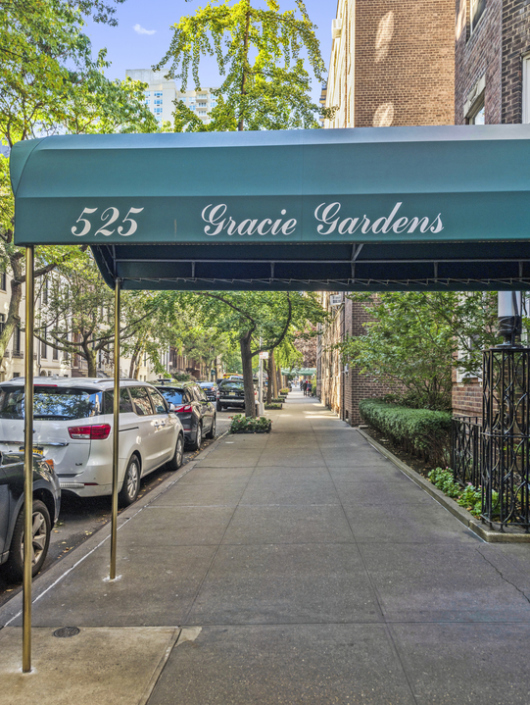 525 East 89th Street, Unit 3A Manhattan, NY 10128 - Photo 10 of 11 a view of a building with a couple of cars parked on road