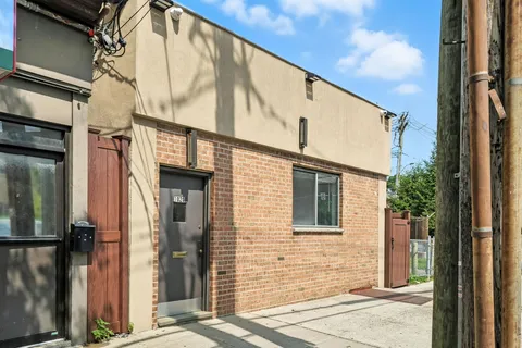 a view of a house with a street
