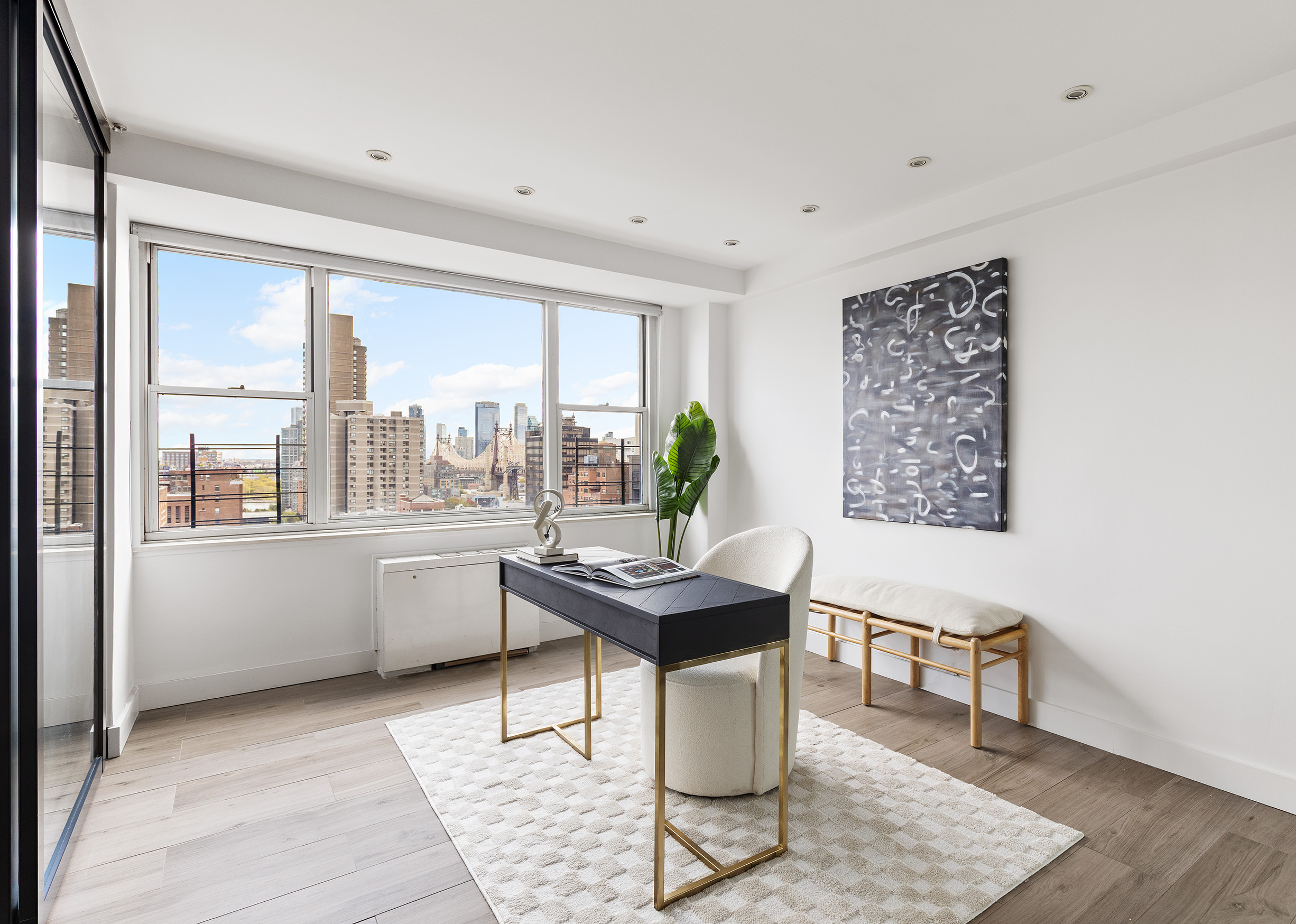 340 East 64th Street, Unit 19L Manhattan, NY 10065 - Photo 4 of 17 a workspace with furniture and window
