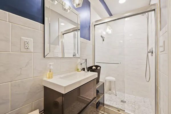 a bathroom with a sink and mirror