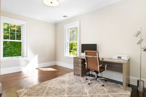 a living room with furniture and a rug