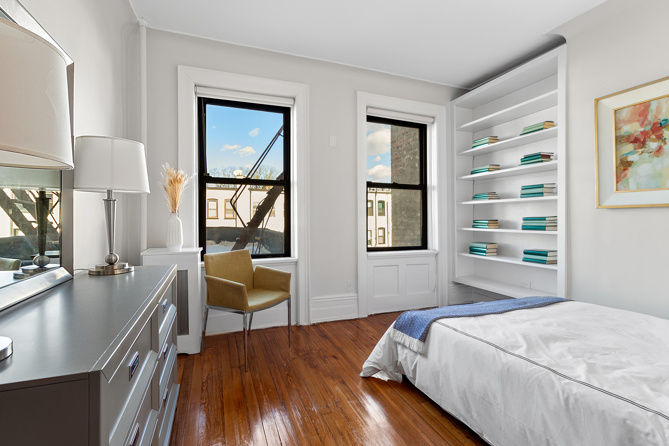 579 5th Street Brooklyn, NY 11215 - Photo 6 of 19 a bedroom with a bed and a table in it