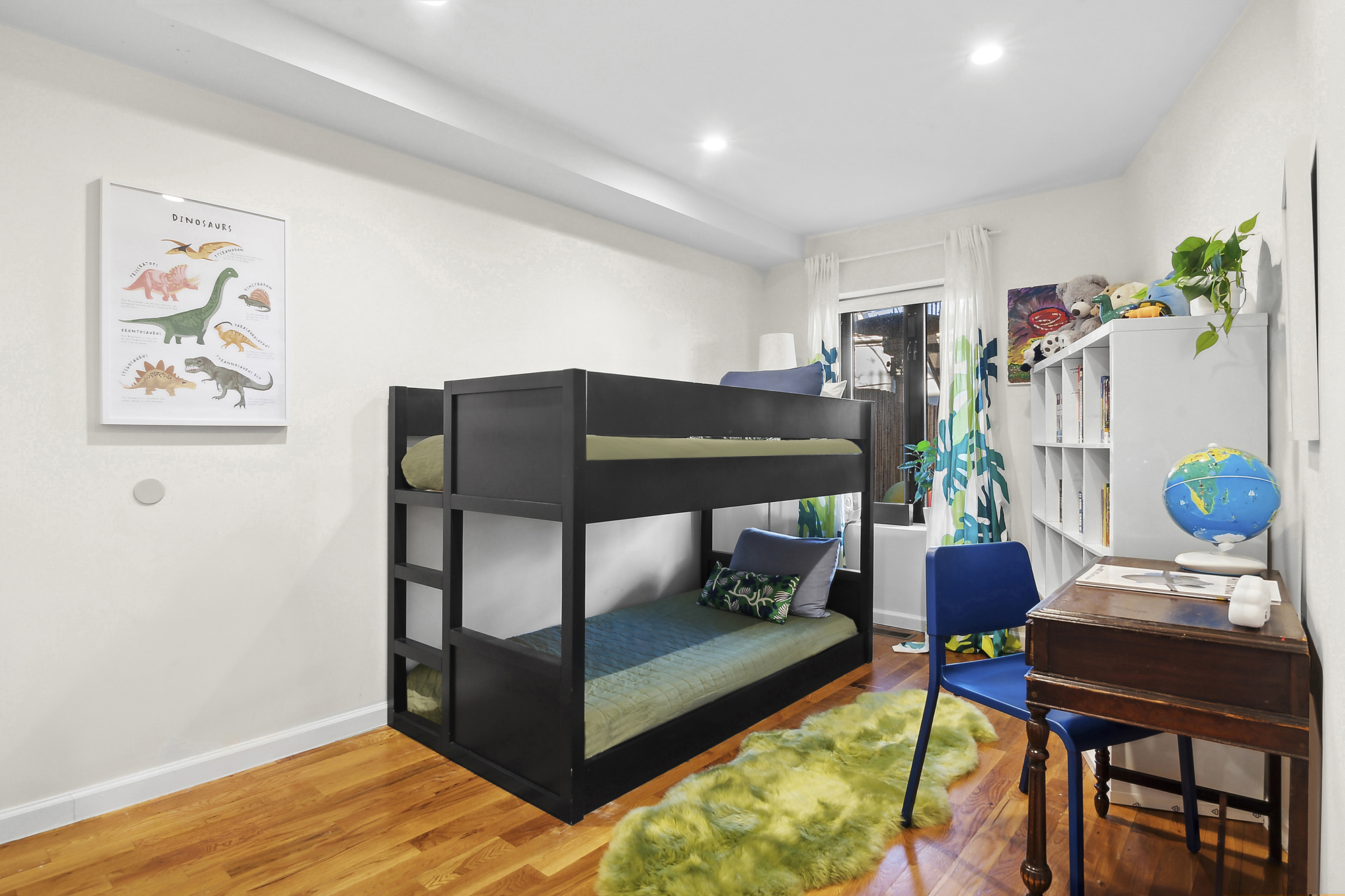 147 Herkimer Street Brooklyn, NY 11216 - Photo 16 of 25 a bedroom with furniture and a potted plant