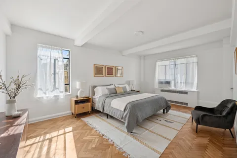 a bed room with a bed and a couch