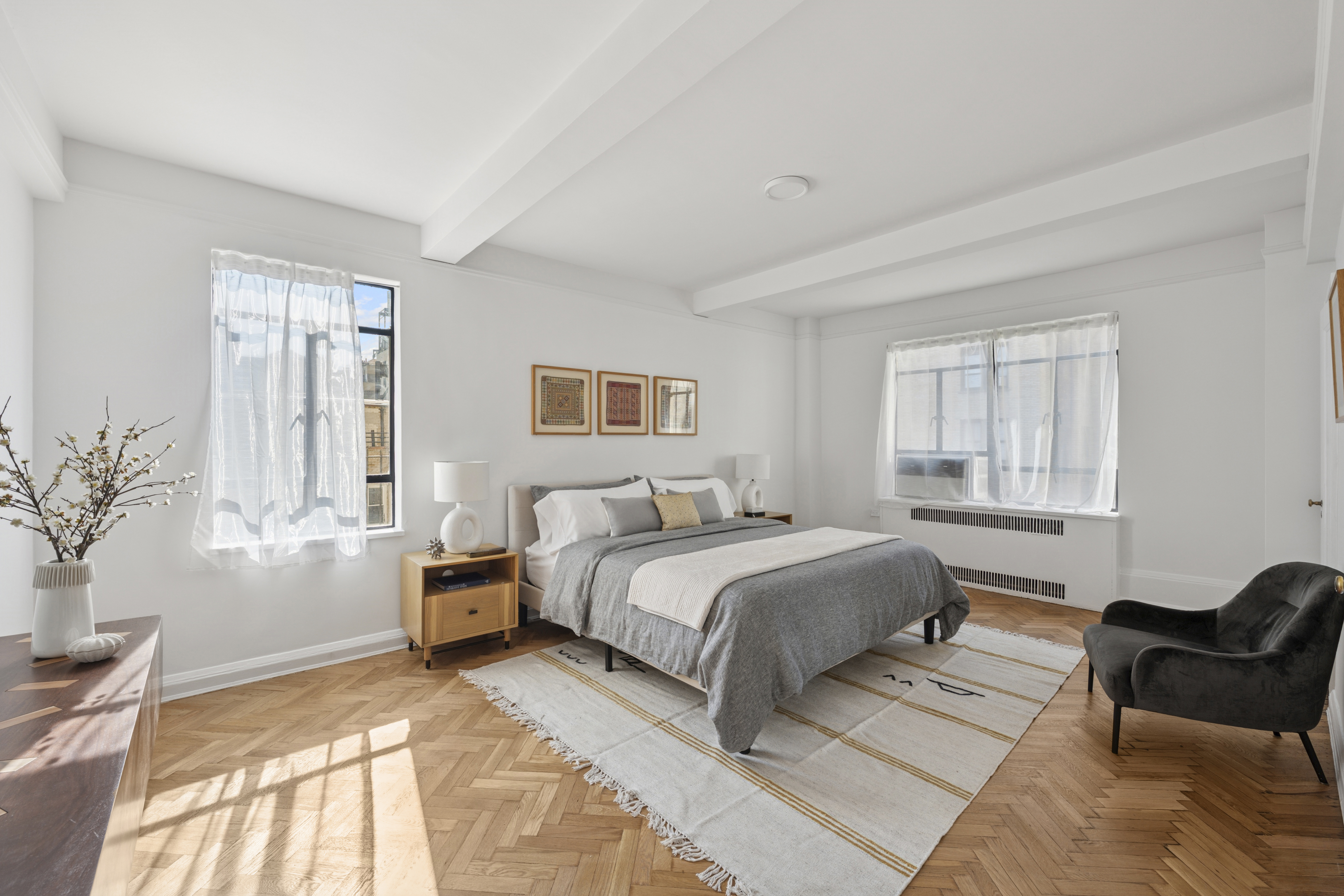 140 Riverside Drive, Unit 10N Manhattan, NY 10024 - Photo 8 of 21 a bed room with a bed and a couch