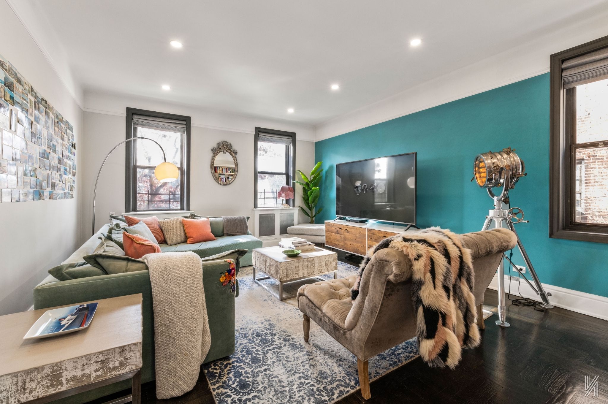 35-06 88th Street, Unit 3G Queens, NY 11372 - Photo 1 of 20 a living room with furniture and a flat screen tv