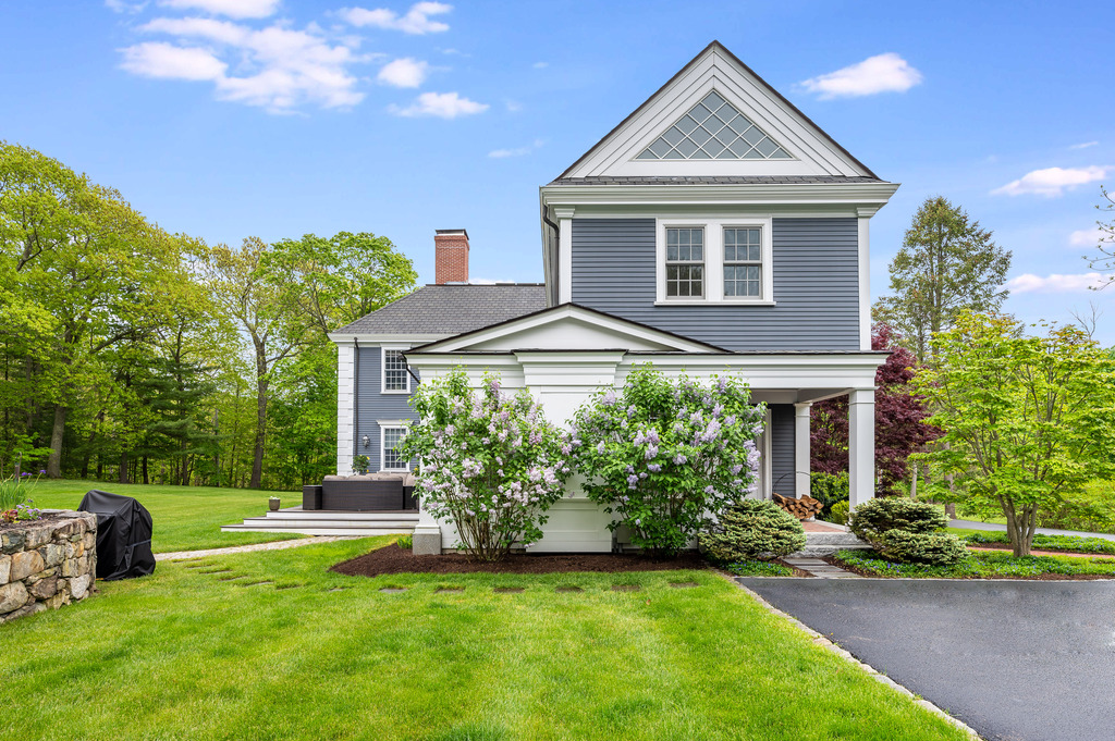 79 Pine Street Dover, MA 02030 - Photo 3 of 25 a front view of a house with a yard