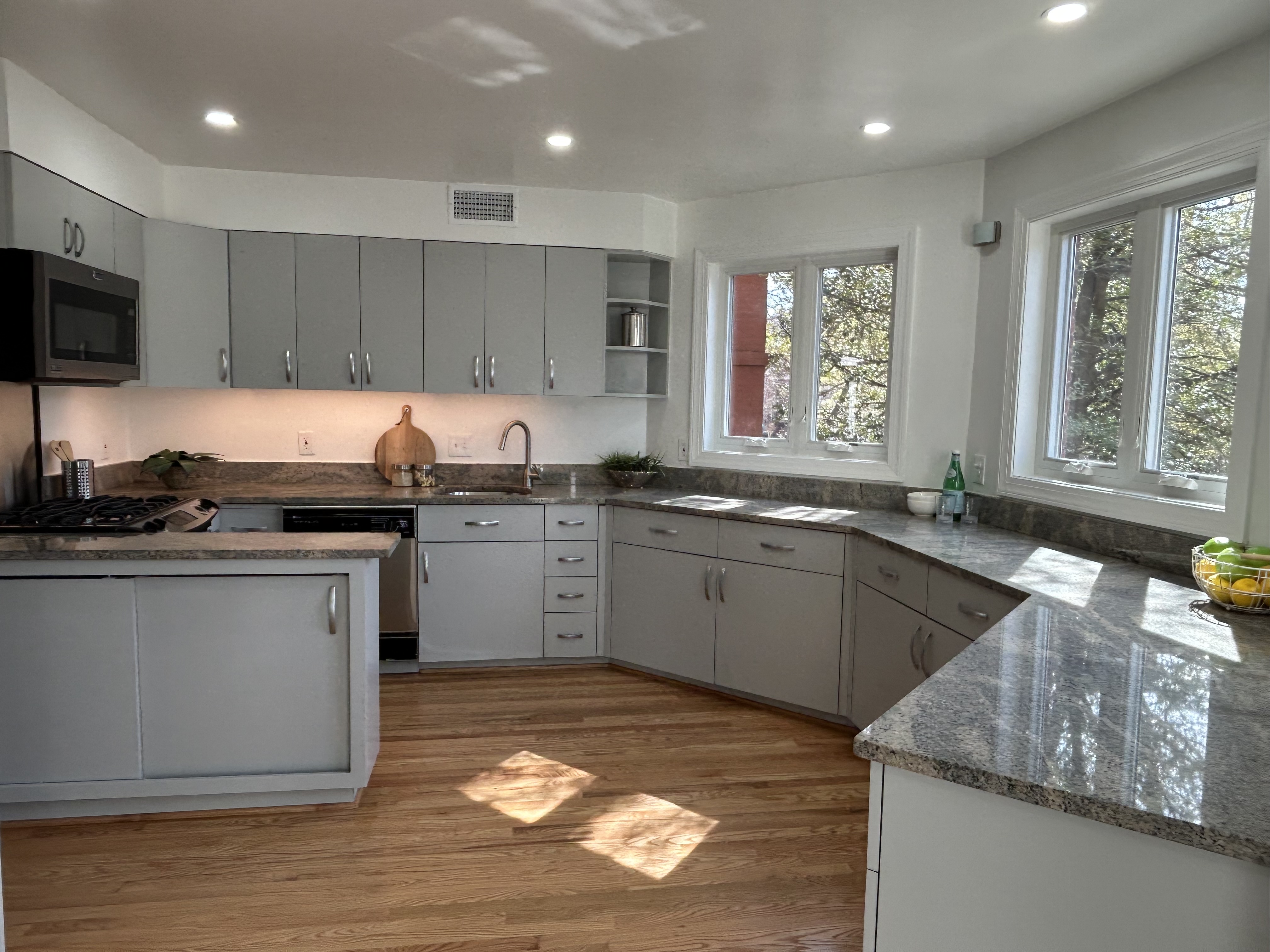 1823 16th Street Northwest, Unit 2 Washington, DC 20009 - Photo 2 of 19 a kitchen with granite countertop a sink a counter top space and cabinets