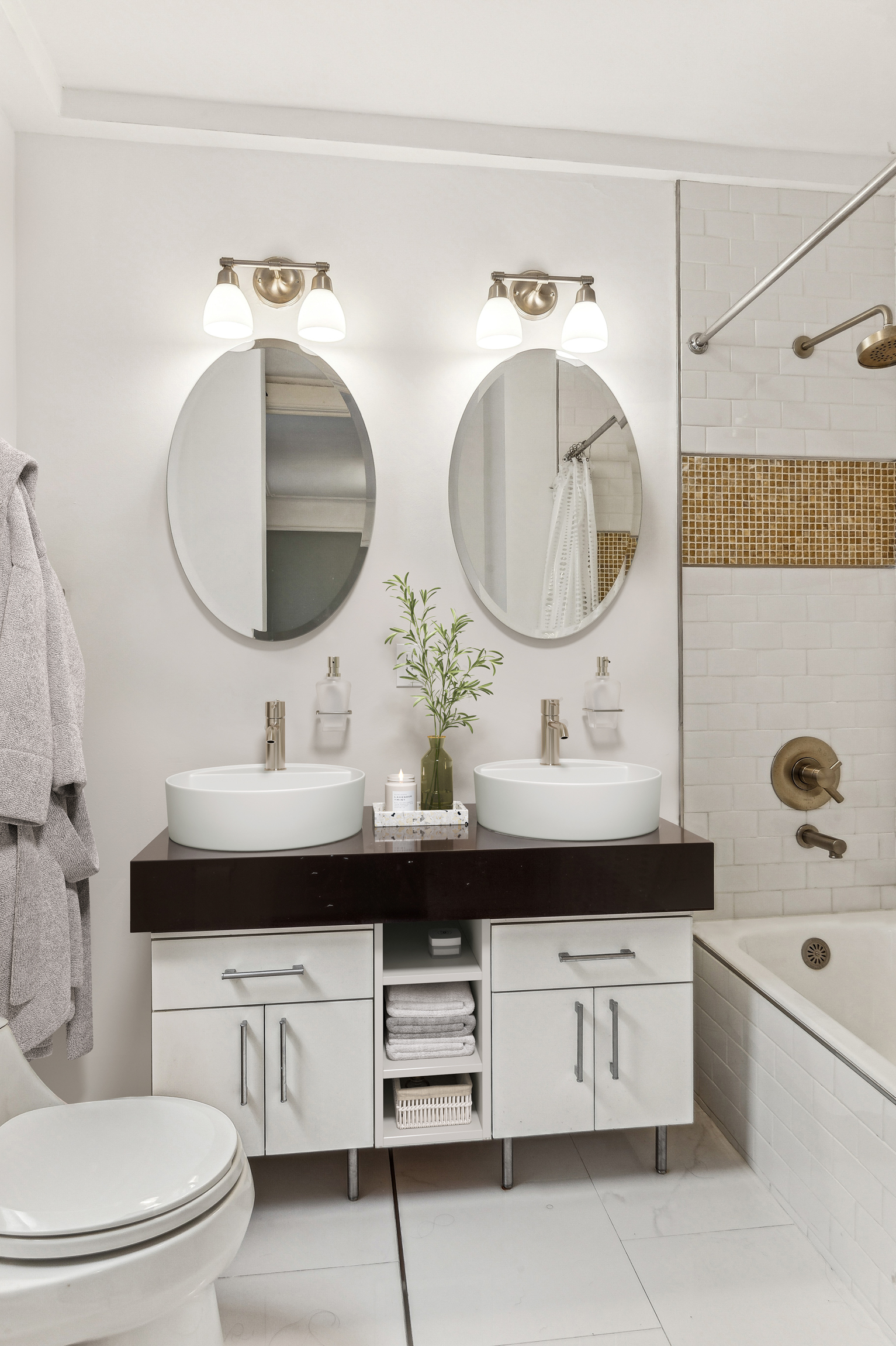 150 West 87th Street, Unit 7B Manhattan, NY 10024 - Photo 5 of 10 a bathroom with a double vanity sink and a mirror
