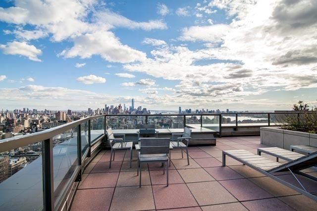 101 West 24th Street, Unit 26D Manhattan, NY 10011 - Photo 11 of 18 a terrace with outdoor seating and city view