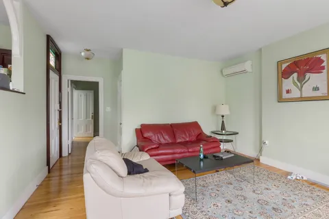 a living room with furniture and a rug