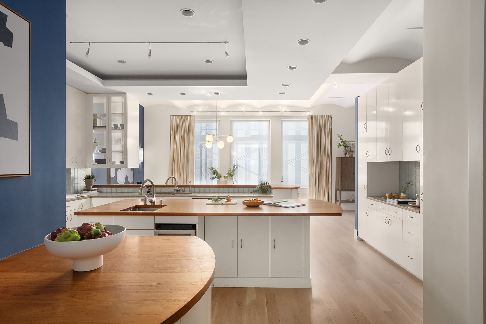 114 Liberty Street, Unit 7 Manhattan, NY 10006 - Photo 8 of 15 a kitchen with stainless steel appliances kitchen island granite countertop a sink and cabinets